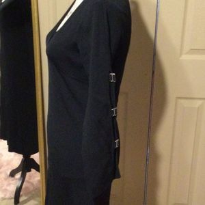 MTWT 9-5 black rayon stretch dress with peek a boo sleeves Size small. Runs big